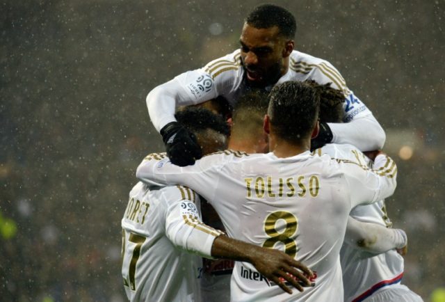 Lyon's players celebrate after scoring a goal during the French L1 match vs Ajaccio in Dec