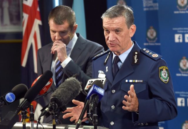 New South Wales police commissioner Andrew Scipione (R) and state Premier Mike Baird speak