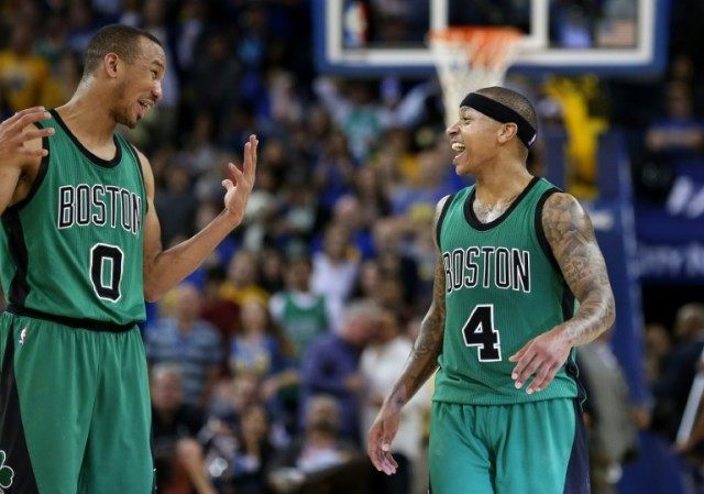 Isaiah Thomas (R) and Avery Bradley of the Boston Celtics celebrate their win over the Gol