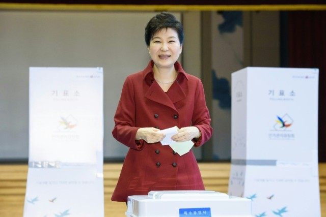 South Korean President Park Geun-Hye casts her vote in parliamentary elections at a pollin
