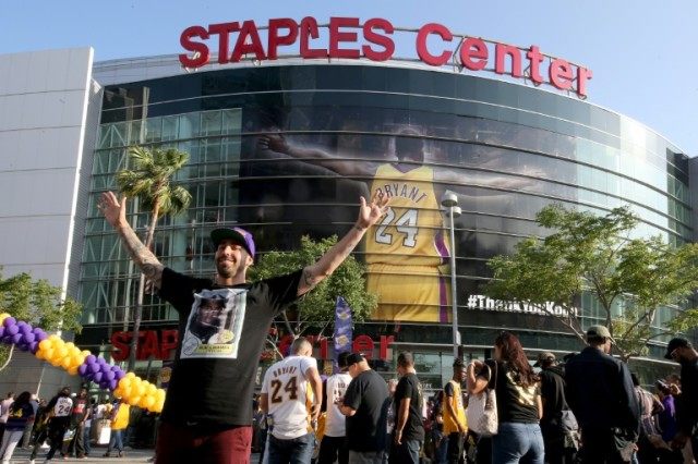 Fans gather outside Staples Center ahead of Kobe Bryant's final NBA game, in Los Angeles,