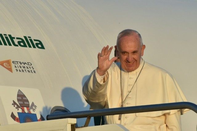 Pope Francis arrived at Lesbos airport for a five-hour visit during which he will spend ti