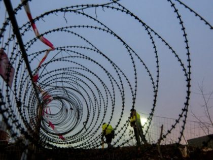 A barbed wire fence is erected at a border crossing between Austria and Slovenia at Spielfeld, Austria in December 2015