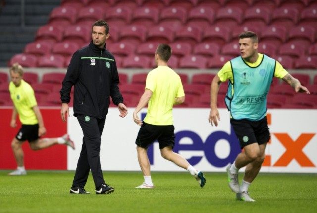 Celtic's coach Ronny Deila (C-L) oversees a team training session in Amsterdam, in Septemb
