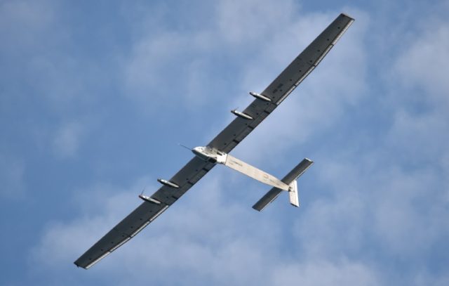 Solar Impulse 2, piloted by Bertrand Piccard, flies above San Francisco before a scheduled