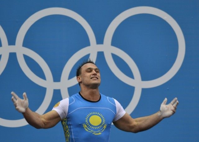 Kazakhstan's Ilya Ilyin celebrates his new Olympic record during the men's 94kg group A we