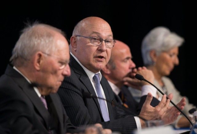 French Finance Minister Michel Sapin speaks next to German Finance Minister Wolfgang Schau