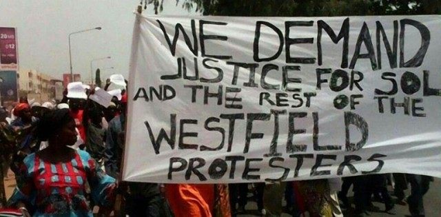 People demonstrate on April 16, 2016 in Banjul following the death of an opposition figure