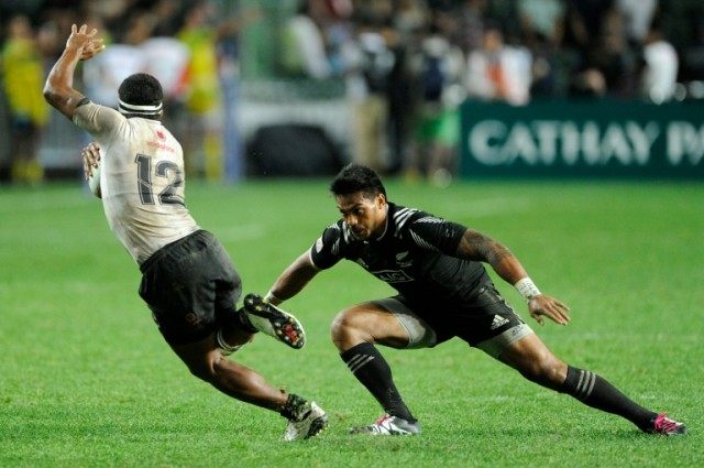 Fiji's Vatemo Ravouvou (R) on the way to victory against rivals New Zealand, winning 21-7