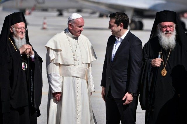 Pope Francis (2nd-L) meets Greek Prime Minister Alexis Tsipras (2nd-R), arriving on the Gr
