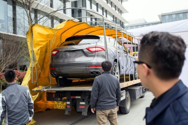 Maserati Levante sport-utility vehicles are offloaded in Hangzhou, eastern China's Zhejian