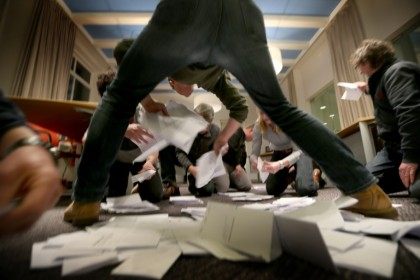 Officials count the votes of the Dutch referendum about the association agreement between