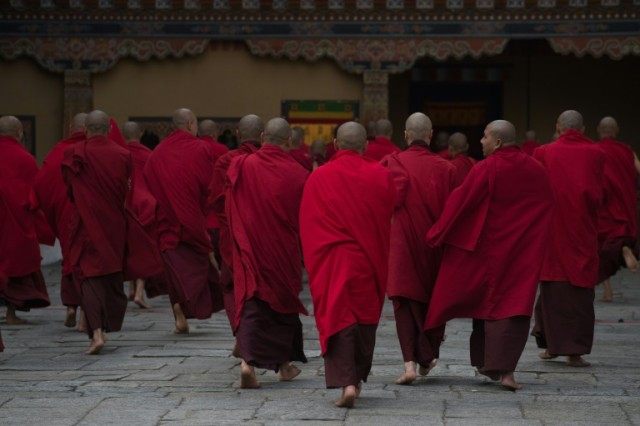 Buddhist monks in the Tashicho Dzong in Thimphu on April 14, 2016