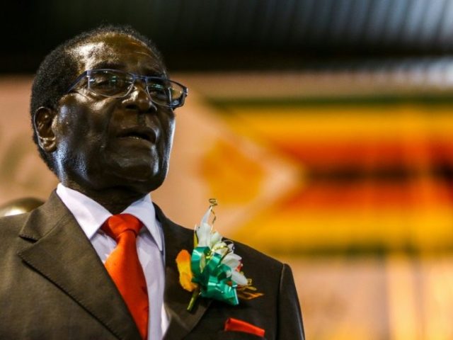 Zimbabwe President Robert Mugabe attends a meeting with the Zimbabwe National Liberation W