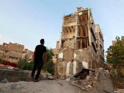 YEMEN, SANAA : A Yemeni man stands on March 23, 2016 in front of UNESCO-listed buildings t