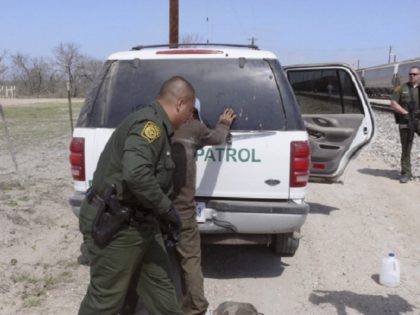 NBC NEWS -- Pictured: Border Patrol Agents arrest 8 suspected illegals and read them their Miranda Rights in Maverick County, near Eagle Pass, TX, as they try to ride a freight train into the United States on February 27, 2007 -- Photo by: Al Henkel/NBC NewsWire
