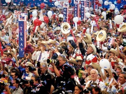 The Texas delegation cheers as Republican presidential candidate George W Bush excepts the nomination at the Republican National Convention..