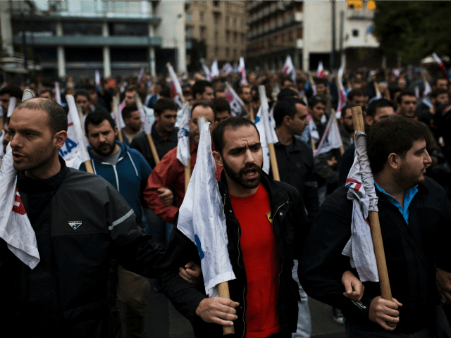 People demonstrate against a new package of tax hikes and …