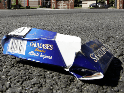 Lille, FRANCE: A crushed Gauloises cigarette packet lays before the Franco-Spanish Altadis fatory in Lille 31 August 2005 as the factory stops producing the legendary cigarettes, bringing to an end almost a century of history.