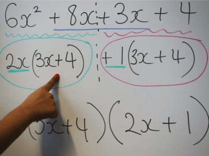LONDON, ENGLAND - DECEMBER 01: A teacher writes an equation on a whiteboard during a maths lesson at a secondary school on December 1, 2014 in London, England. Education funding is expected to be an issue in the general election in 2015.