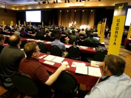 Delegates listen to speeches in the main hall at the National Libertarian Party Convention, Friday, May 27, 2016, in Orlando, Fla.