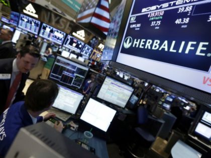 Thursday, Feb. 28, 2013, file photo, a pair of specialists confer at the post that handles Herbalife on the floor of the New York Stock Exchange. Herbalife, the seller of supplements and weight-loss products currently under federal investigation as a potential pyramid scheme, announced Thursday, March 3, 2016, that it …