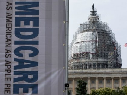 In this July 30, 2015 file photo, a sign supporting Medicare is seen on Capitol Hill in Washington.