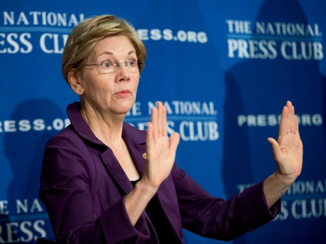 FILE - In this Nov. 18, 2015, file photo, Sen. Elizabeth Warren, D-Mass. gestures before speaking at the National Press Club in Washington.