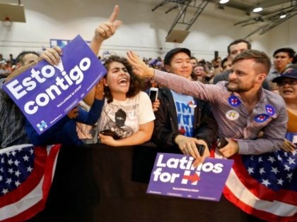 A single unidentified protester, center, heckles Democratic presidential candidate Hillary Clinton at a campaign stop at East Los Angeles College in Los Angeles, Thursday, May 5, 2016.