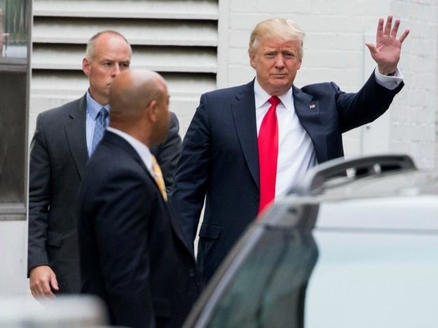 Donald Trump, the GOP’s presumptive presidential nominee, waves as he arrives to meet wi