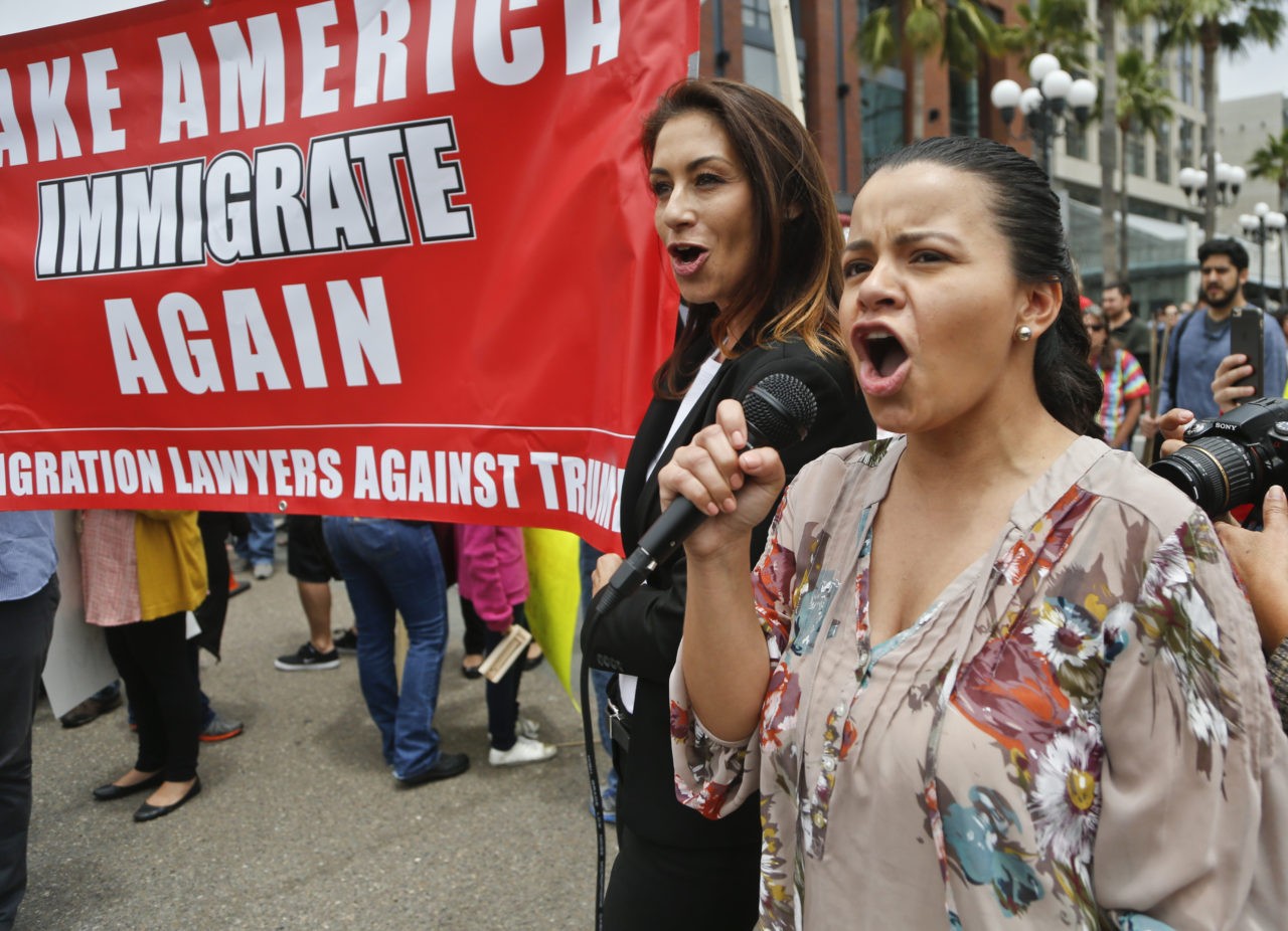 Anti-Trump demonstrators flood the street across from the the San Diego Convention Center where Republican presidential candidate Donald Trump was scheduled to speak, Friday, May 27, 2016, in San Diego. (AP Photo/Lenny Ignelzi)