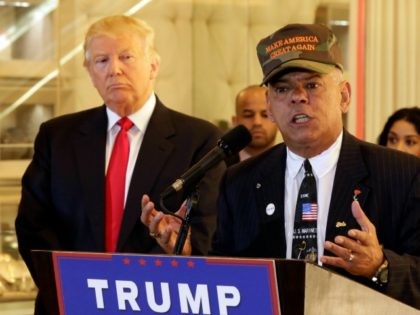 Republican presidential candidate Donald Trump listens at ;eft as Al Baldasaro, a New Hampshire state representative, speaks during a news conference in New York, Tuesday, May 31, 2016.