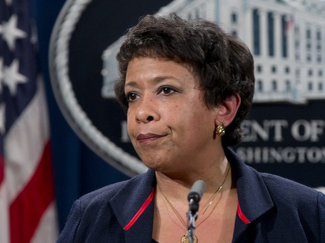 Attorney General Loretta Lynch pauses as she speaks during a news conference at the Justic