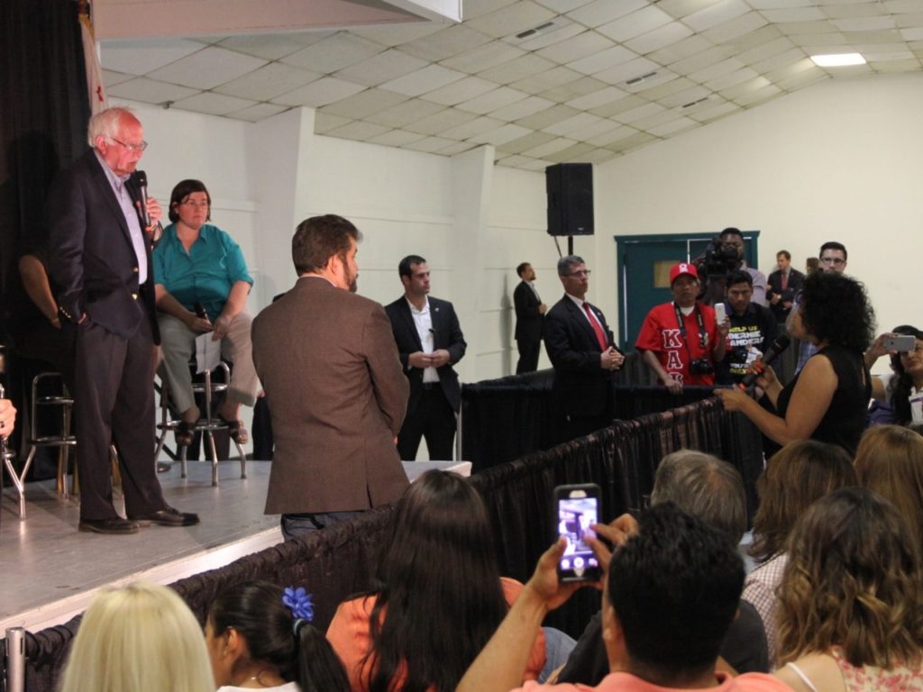 Bernie Sanders and Latino activists (Jennifer Lawrence and Dustin Stockton / Breitbart News)