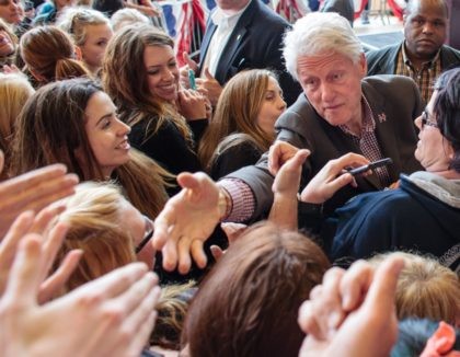 Bill Clinton handshake women (Rob Kerr / AFP / Getty)