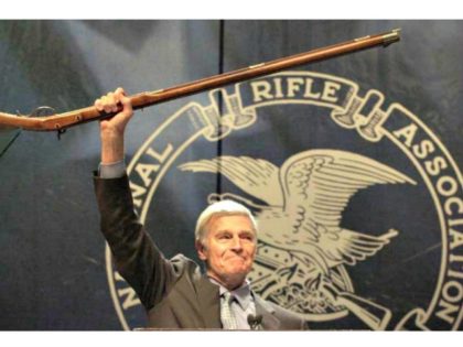 Charleston Heston brandishes rifle NRA AP