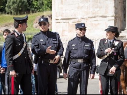 China police flank their Italian counterparts in cooperative law enforcement project.
