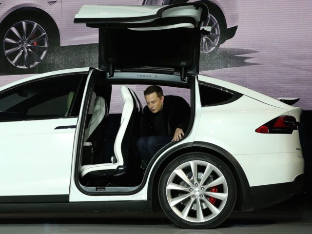 Elon Musx in Tesla X (Justin Sullivan / Getty)