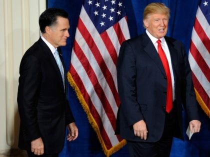 Mitt Romney (L) and Donald Trump arrive at a news conference held by Trump to endorse Romn