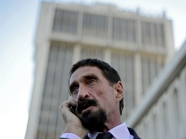 US anti-virus software pioneer John McAfee speaks on his mobile phone in front of the Supr