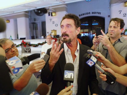 MIAMI BEACH, FL - DECEMBER 13: John McAfee talks to the media outside Beacon Hotel where he is staying after arriving last night from Guatemala on December 13, 2012 in Miami Beach, Florida. McAfee is a "person of interest" in the fatal shooting of his neighbor in Belize and turned …