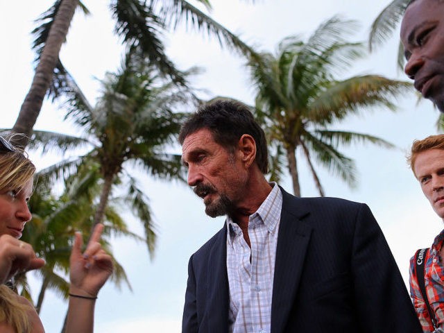 MIAMI BEACH, FL - DECEMBER 13: John McAfee interacts with people after speaking to report