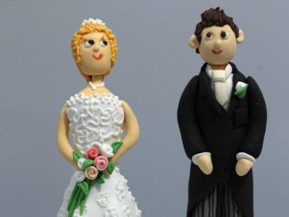 figurines and displayed on a cake during the National Wedding Show at London's Olympia on February 22, 2013 in London, England.