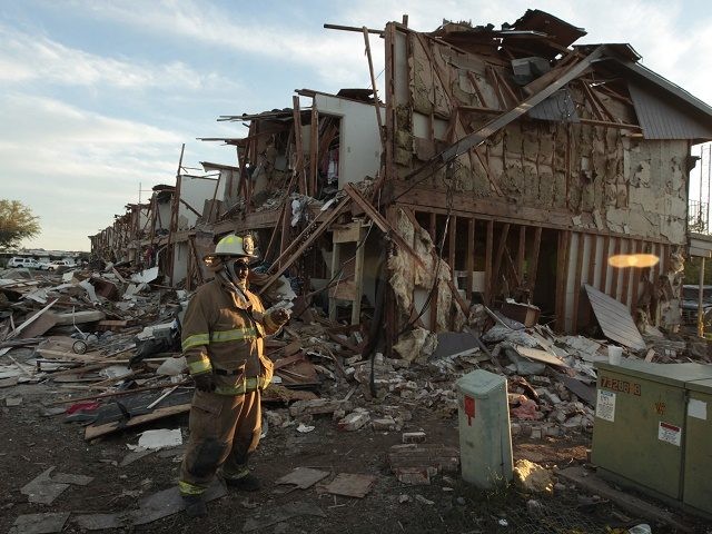 WEST, TX - APRIL 18: A Valley Mills Fire Department personnel walks among the remains of an apartment complex next to the fertilizer plant that exploded yesterday afternoon on April 18, 2013 in West, Texas. According to West Mayor Tommy Muska, around 14 people, including 10 first responders, were killed …