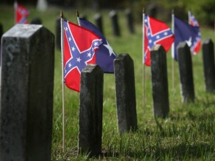 Confederate flags fly over the graves of Confederate soldiers burried in Magnolia Cemetery