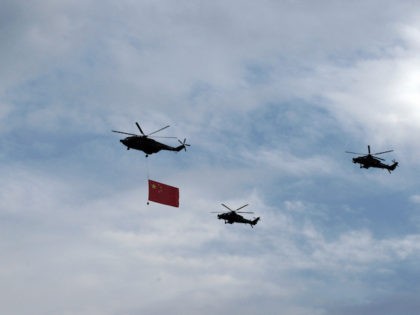 BEIJING, CHINA - AUGUST 23: (CHINA OUT) Chinese military jets fly over the city during a r