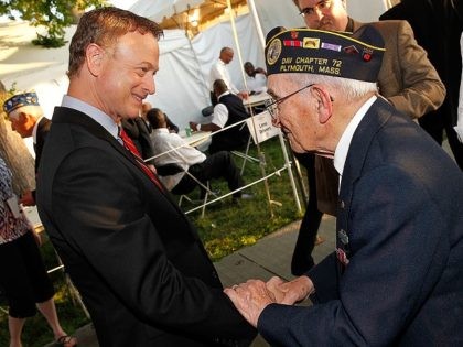 WASHINGTON, DC - MAY 25: Gary Sinise (L) talks with a WWII veteran backstage at the 25th National Memorial Day Concert at the U.S. Capitol, West Lawn on May 25, 2014 in Washington, DC. (Photo by Paul Morigi/Getty Images for Capitol Concerts)