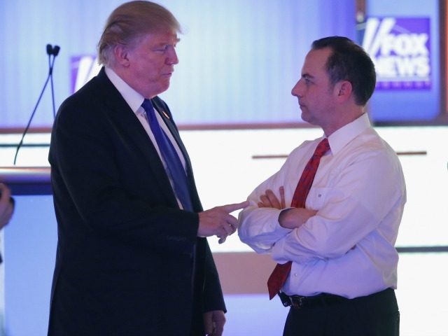 Donald Trump (L) speaks with Reince Priebus on March 3, 2016 in Detroit, Michigan.