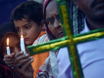 Pakistani Christians hold candles as they stage a rally in Lahore on March 29, 2016