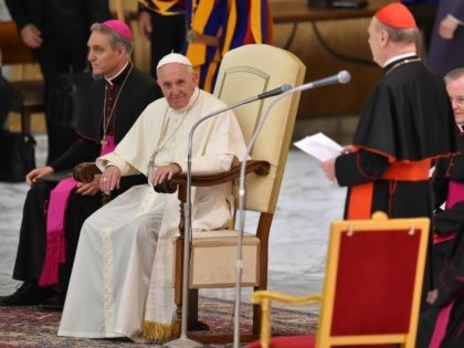 Pope Francis listens to cardinal Cardinal Gianfranco Ravasito during an audience on April